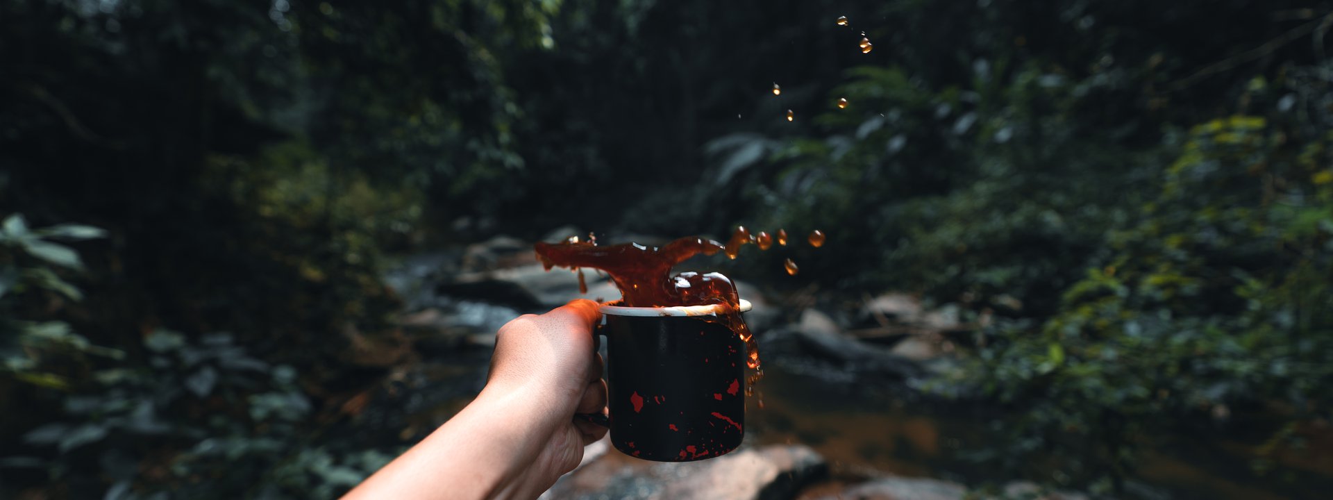 coffee-in-black-cup-camping-in-the-forest